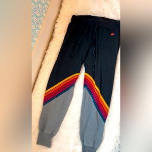 Adviator nation sweatpants size S with red orange yellow striped pattern